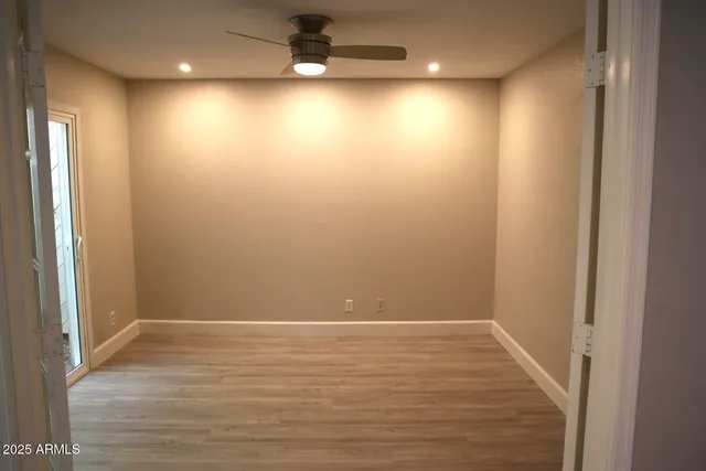 a view of hallway with wooden floor