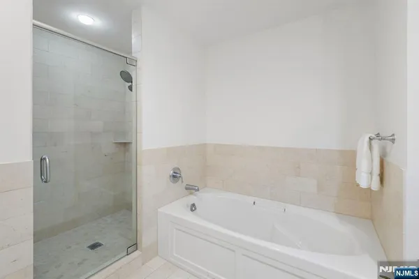 a bathroom with a bathtub and shower