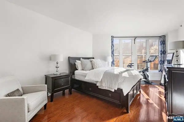 a bed room with a bed and a chair