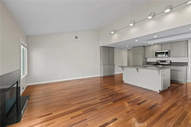 a view of kitchen with wooden floor
