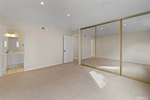 a view of an empty room with a bathroom