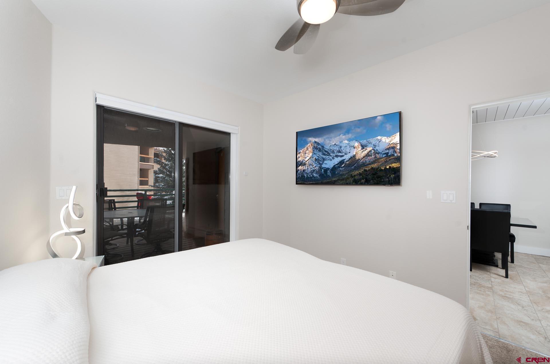 117 Needles Way, Unit 326 Durango, CO 81301 - Photo 13 of 35 a bedroom with a bed and a large mirror