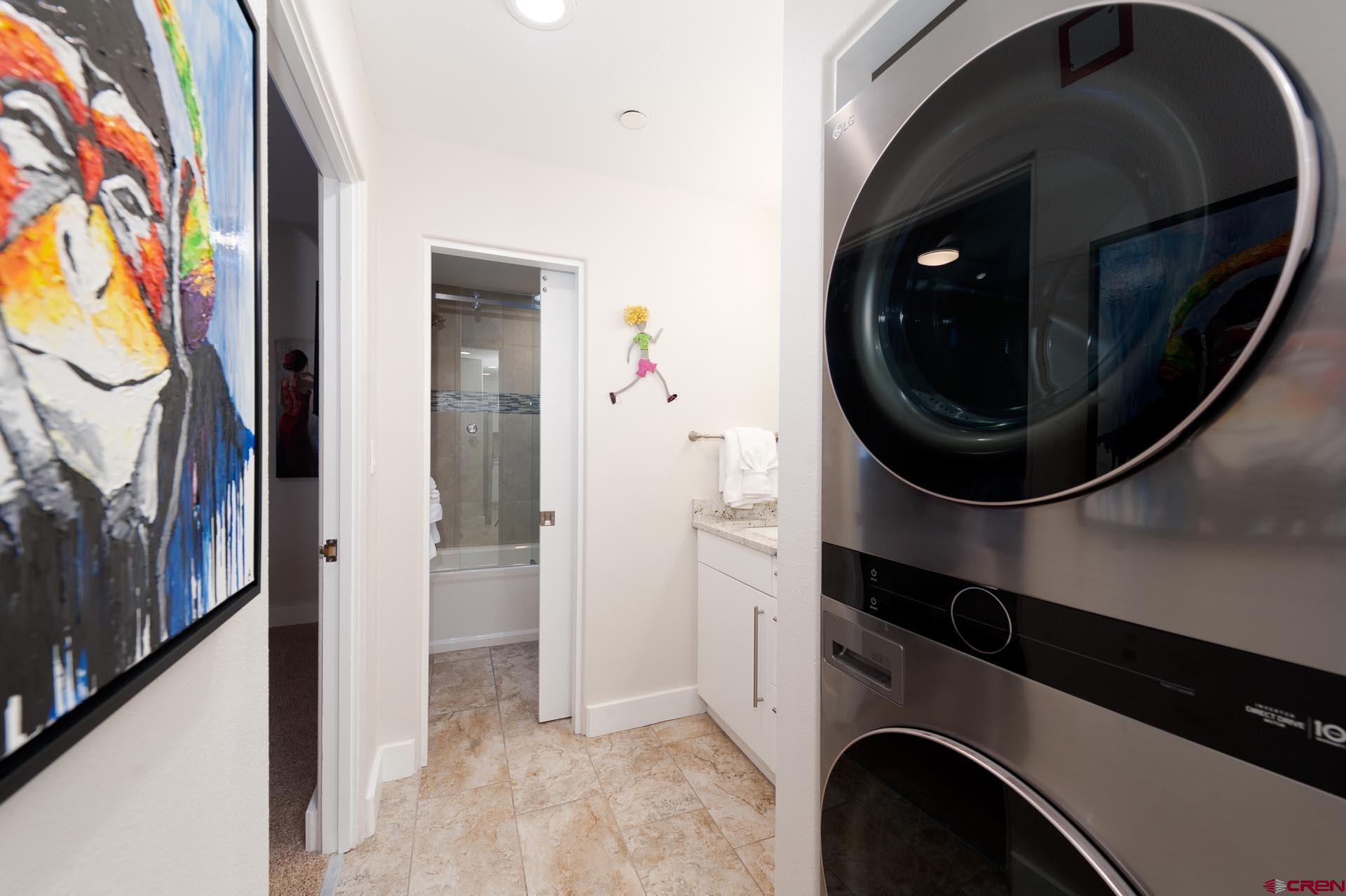 117 Needles Way, Unit 326 Durango, CO 81301 - Photo 16 of 35 a view of a hallway with washer and dryer