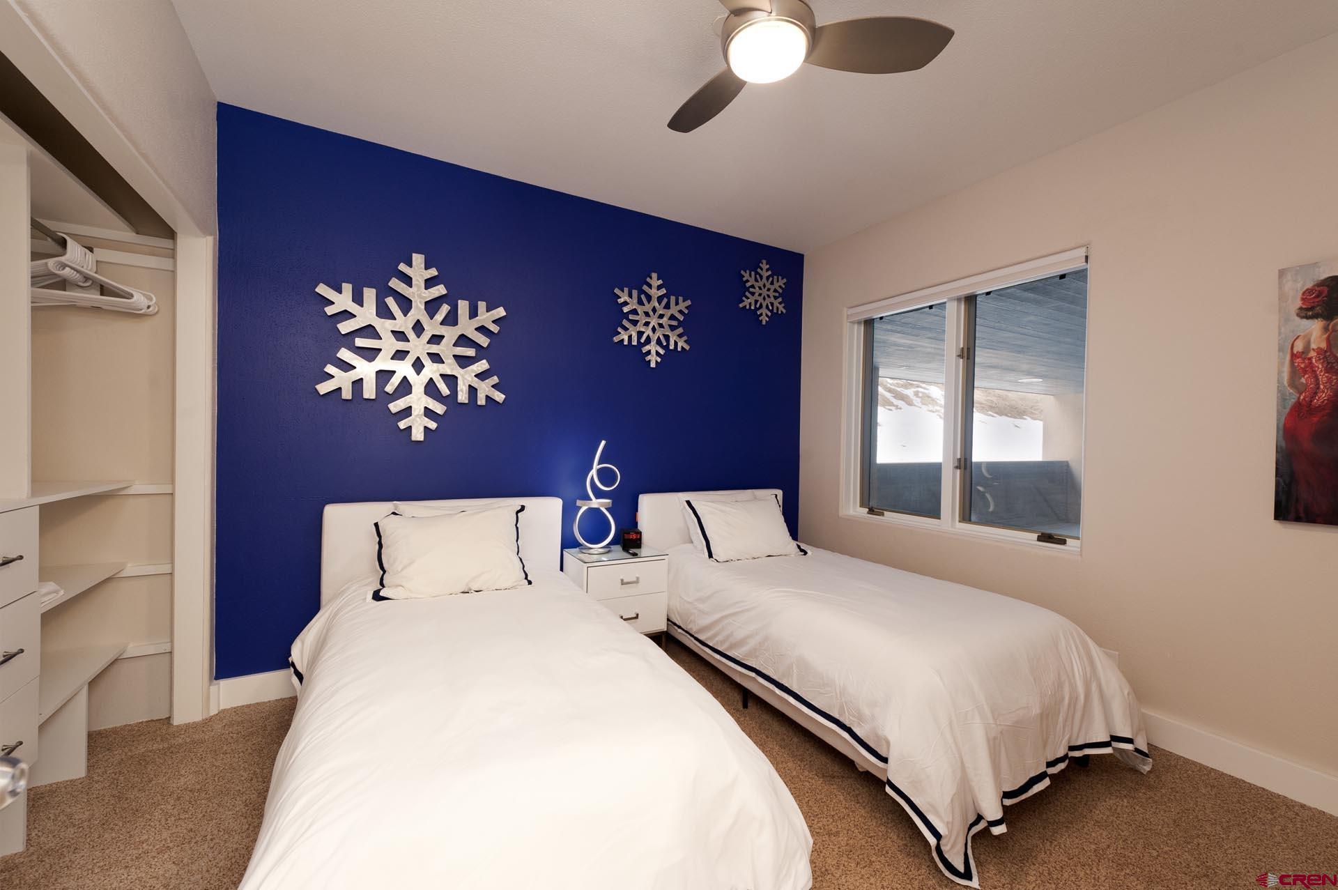 117 Needles Way, Unit 326 Durango, CO 81301 - Photo 17 of 35 a bedroom with bed and window