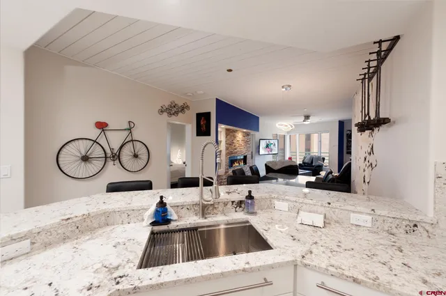 a kitchen with a sink and a refrigerator