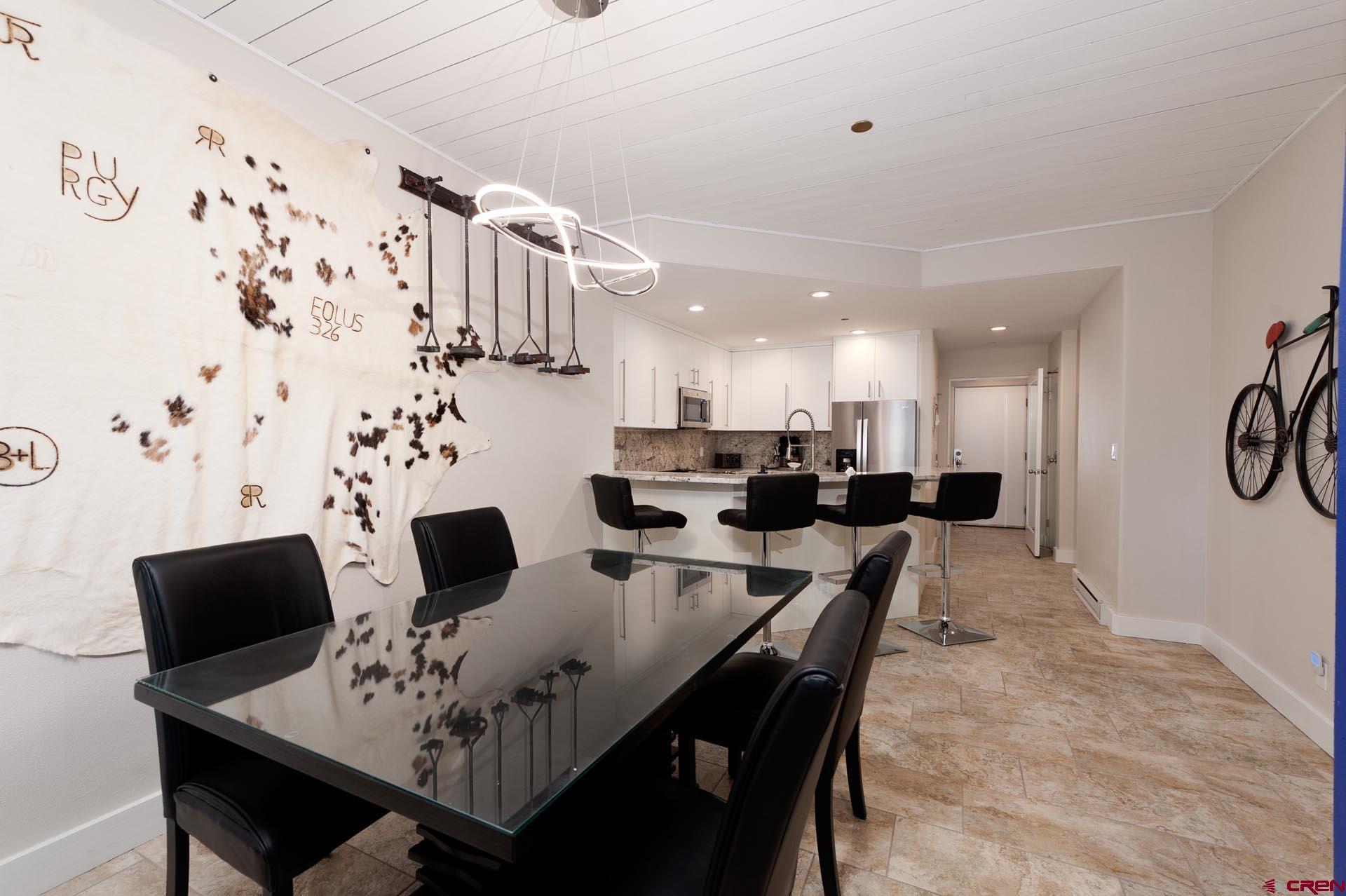 117 Needles Way, Unit 326 Durango, CO 81301 - Photo 10 of 35 a view of a dining room with furniture
