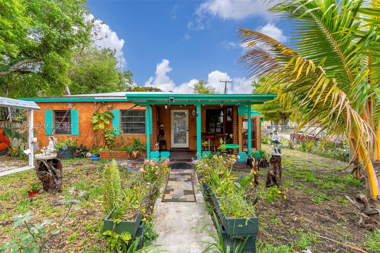 a front view of a house with garden