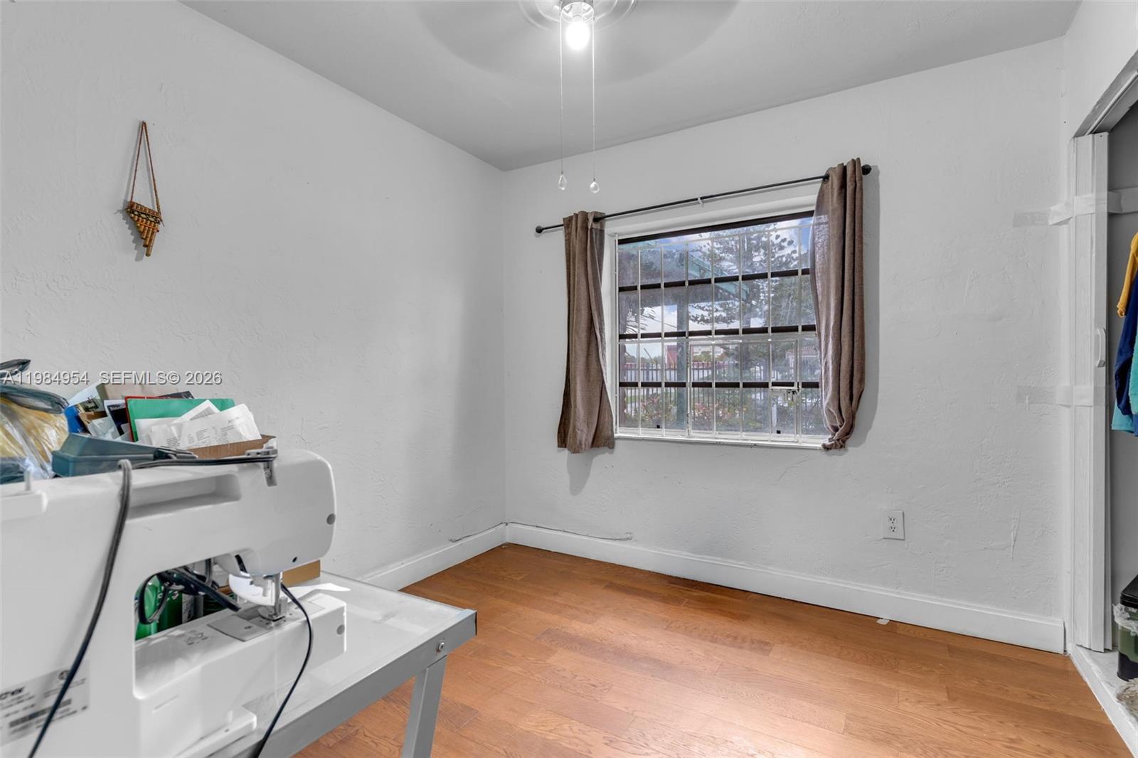 2490 Northwest 59th Street Miami, FL 33142 - Photo 12 of 37 a view of a room that has a bed and a window in it