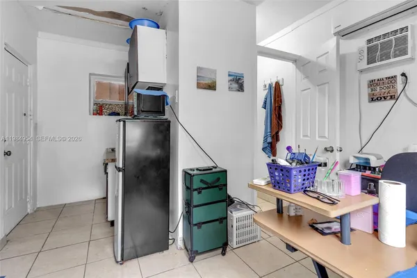 a bathroom with a granite countertop toilet a sink and a mirror
