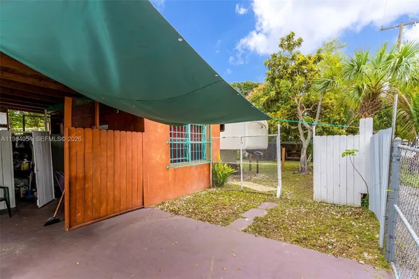 a bathroom with a granite countertop toilet a sink and a mirror