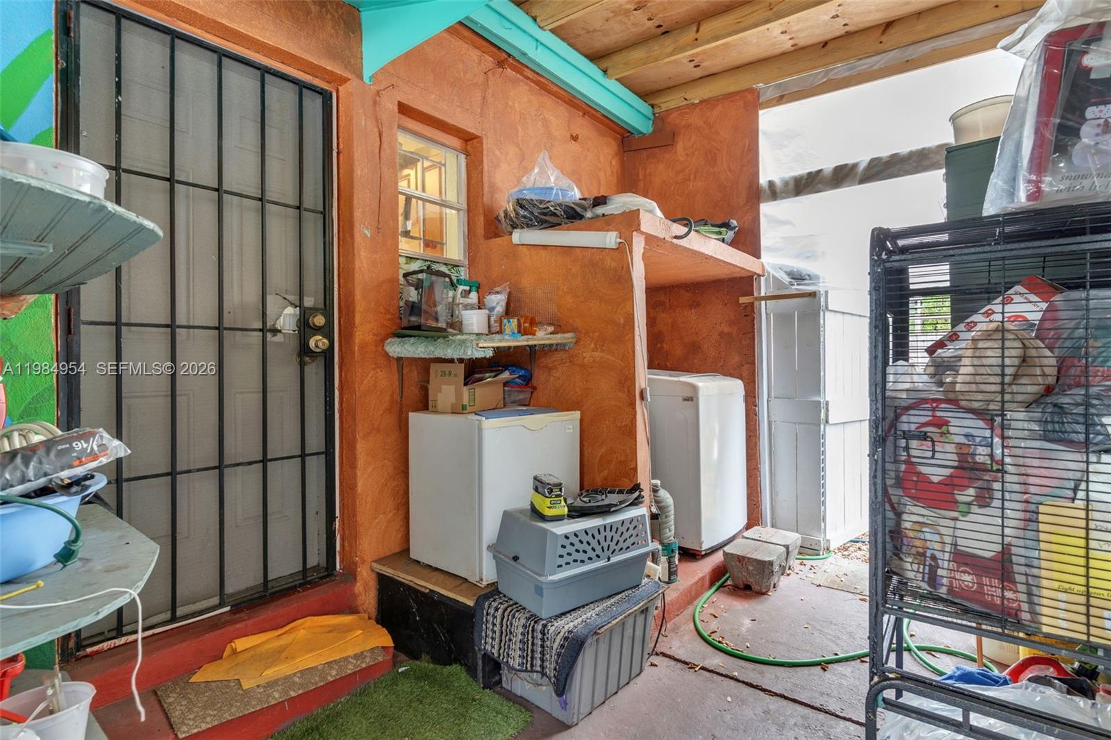 2490 Northwest 59th Street Miami, FL 33142 - Photo 22 of 37 a view of a patio with table and chairs and potted plants