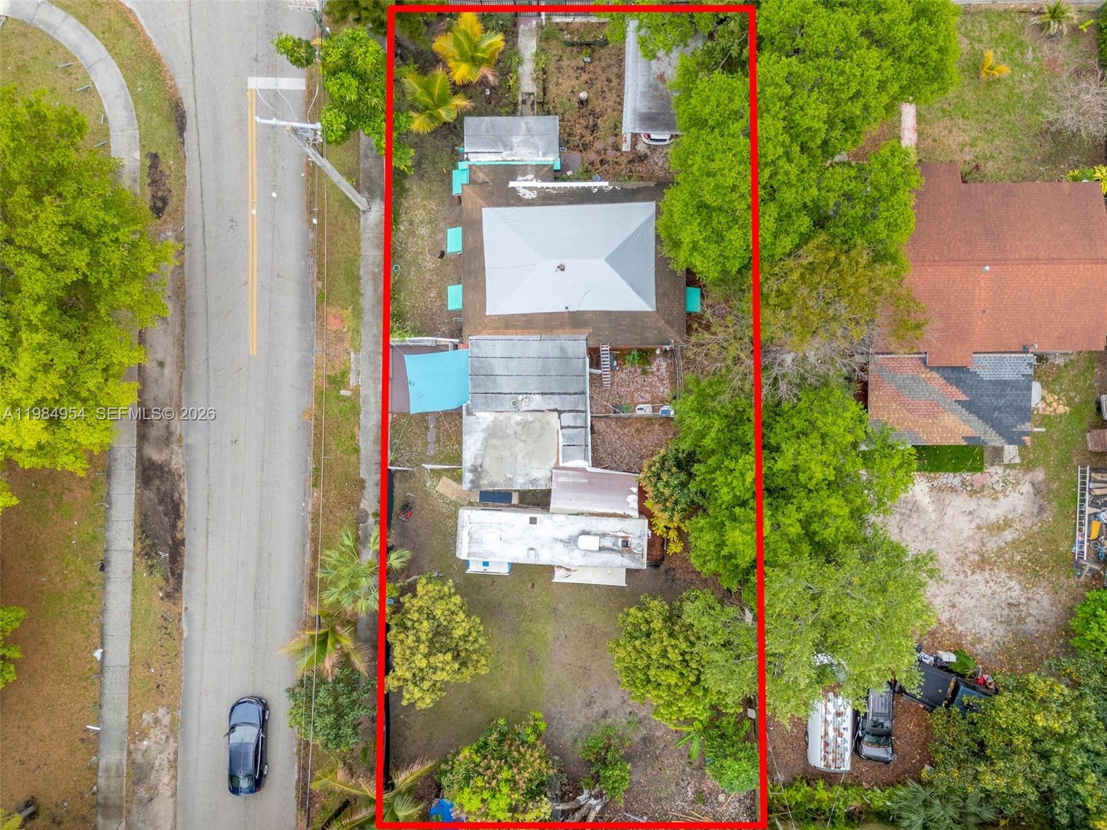 2490 Northwest 59th Street Miami, FL 33142 - Photo 36 of 37 an aerial view of residential houses with outdoor space and street view