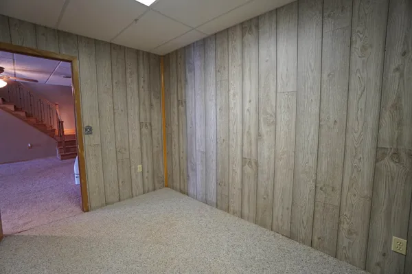 a view of a livingroom with a ceiling fan and window