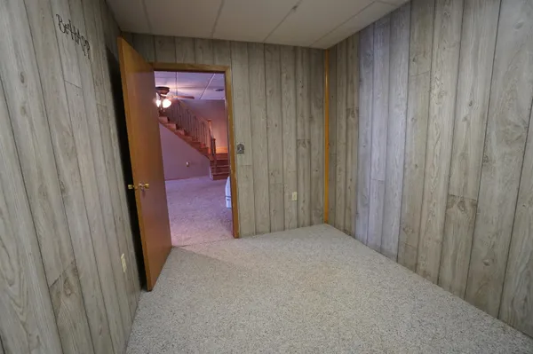 a view of a livingroom with furniture and a ceiling fan