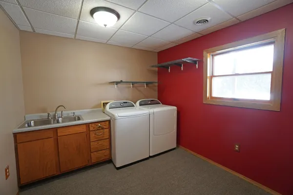 a view of a livingroom with furniture and a ceiling fan