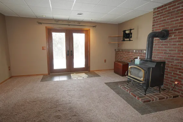 a view of a house with a yard and tree