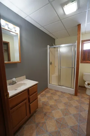 a view of a house with a yard and tree s