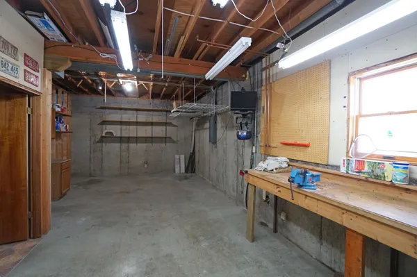 an aerial view of a house with yard and lake view