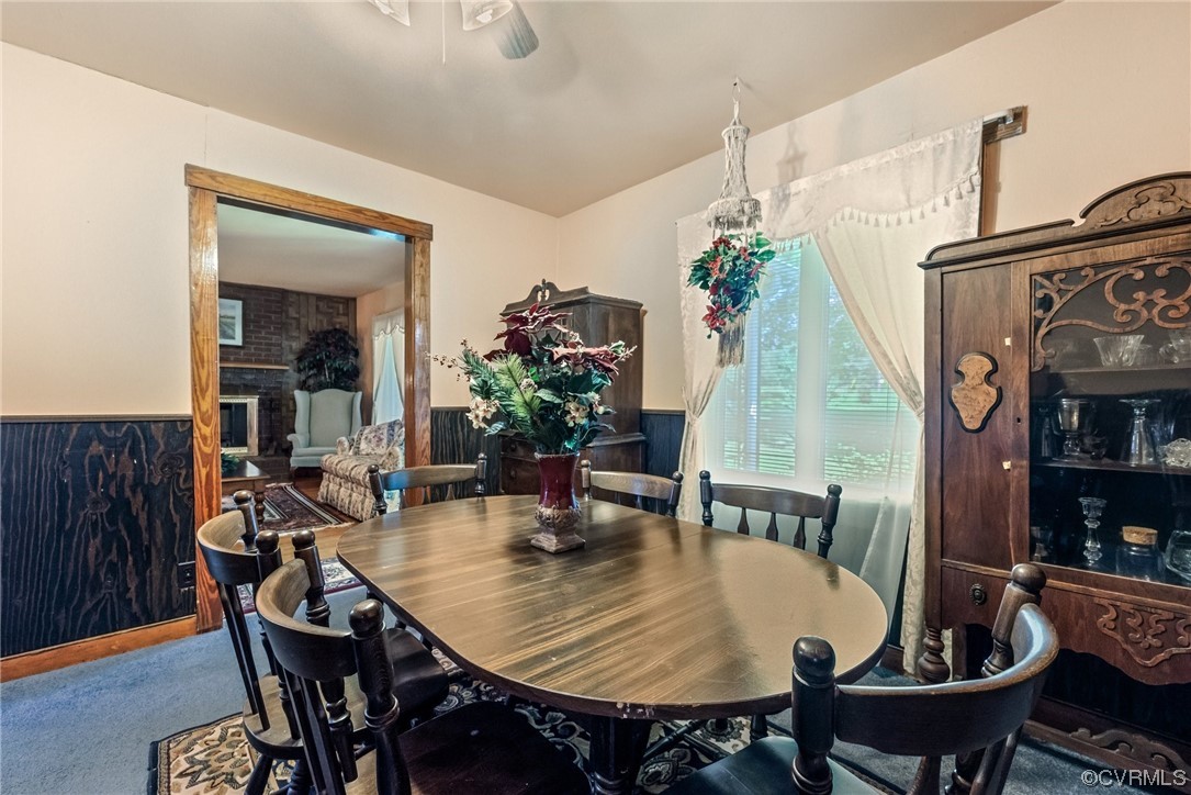 1878 Courthouse Road Louisa, VA 23093 - Photo 11 of 30 a dining room with furniture potted plants and wooden floor