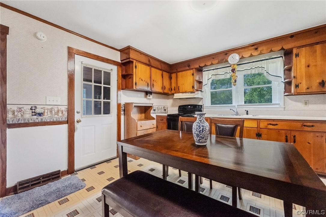 1878 Courthouse Road Louisa, VA 23093 - Photo 19 of 30 a kitchen with a table chairs and refrigerator