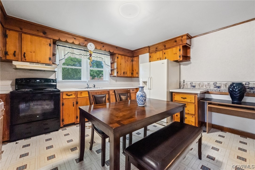 1878 Courthouse Road Louisa, VA 23093 - Photo 20 of 30 a kitchen with a stove a sink and a refrigerator