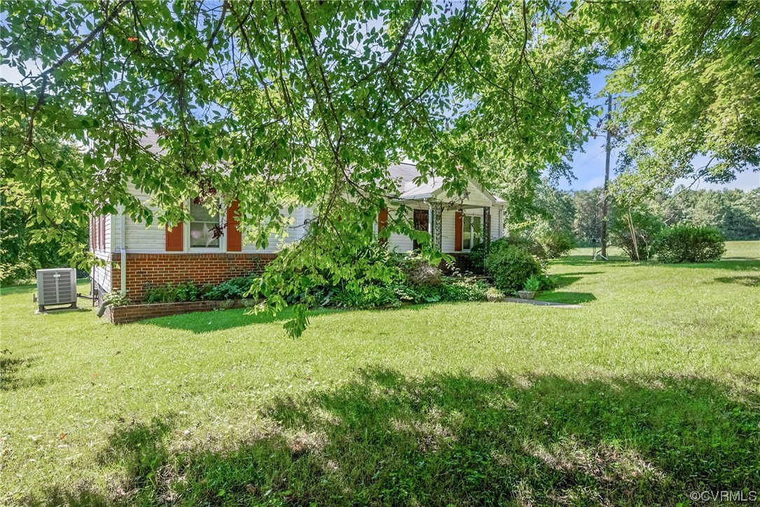 1878 Courthouse Road Louisa, VA 23093 - Photo 3 of 30 a front view of a house with a yard
