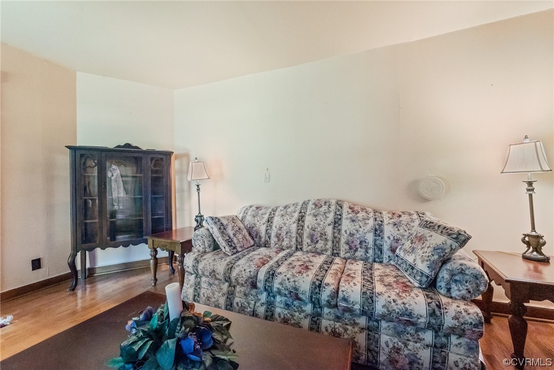 1878 Courthouse Road Louisa, VA 23093 - Photo 9 of 30 a living room with furniture and a floor to ceiling window