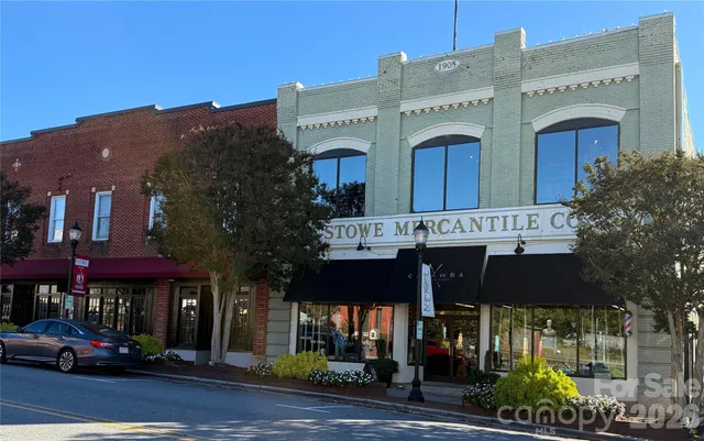 a front view of a building with seating space