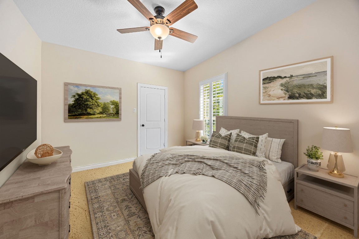 13506 Stagecoach Road Magnolia, TX 77355 - Photo 24 of 37 A cozy secondary bedroom offering soft natural light, plantation shutters, and a serene atmosphere — ideal for guests or a peaceful personal retreat.