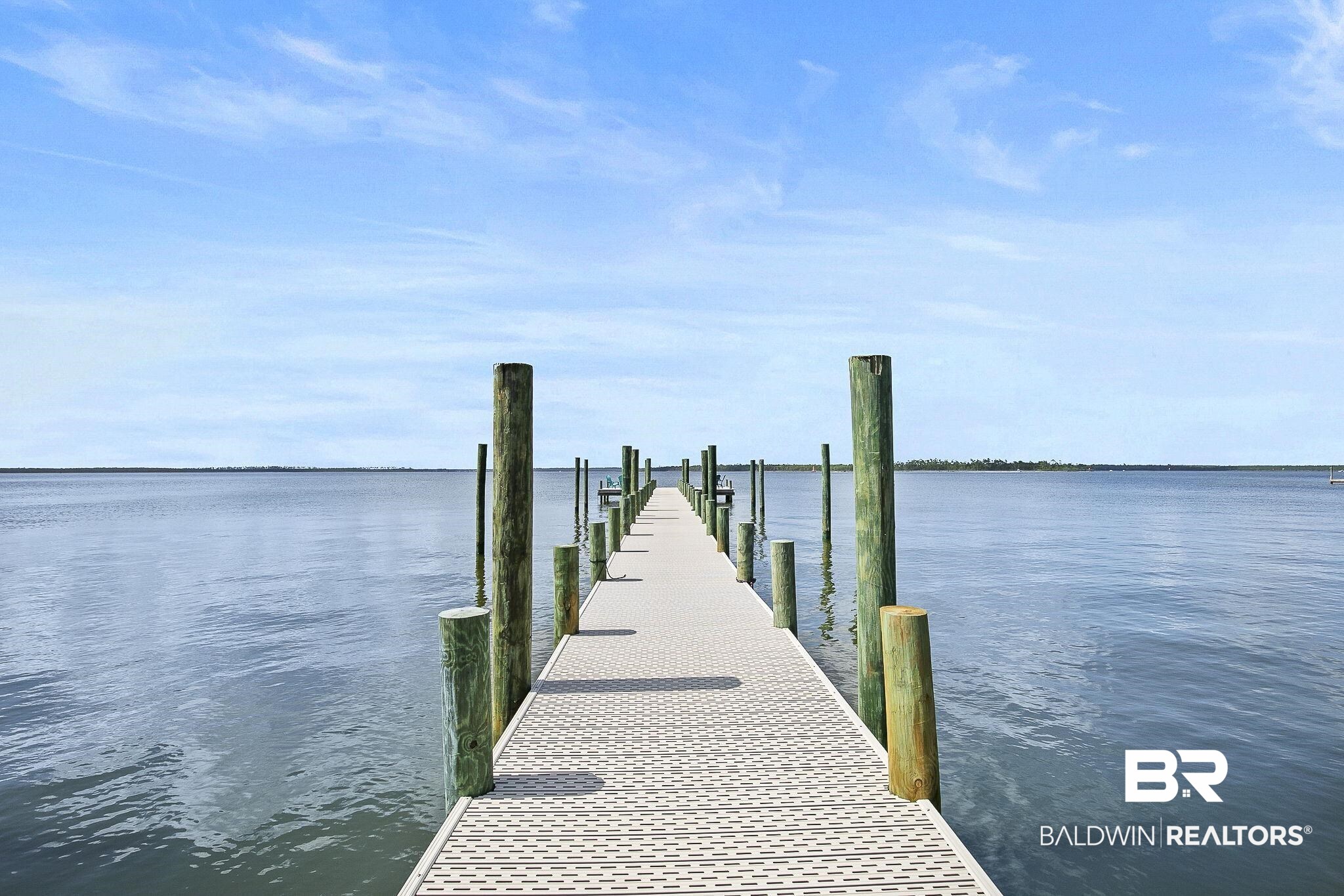 25957 Canal Road, Unit 302 Orange Beach, AL 36561 - Photo 17 of 26 View of dock featuring a water view