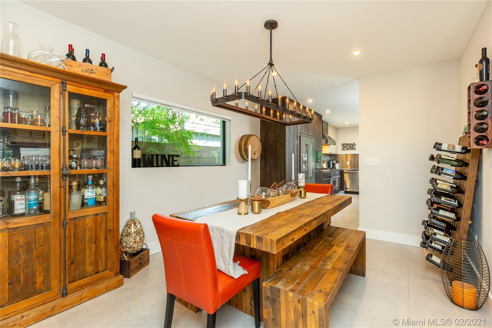 5185 Alton Road Miami Beach, FL 33140 - Photo 11 of 41 a dining room with furniture and window