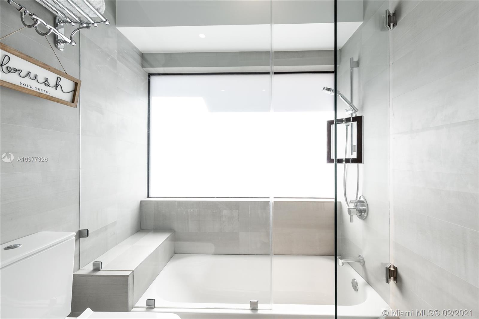 5185 Alton Road Miami Beach, FL 33140 - Photo 22 of 41 a bathroom with a bathtub and a shower