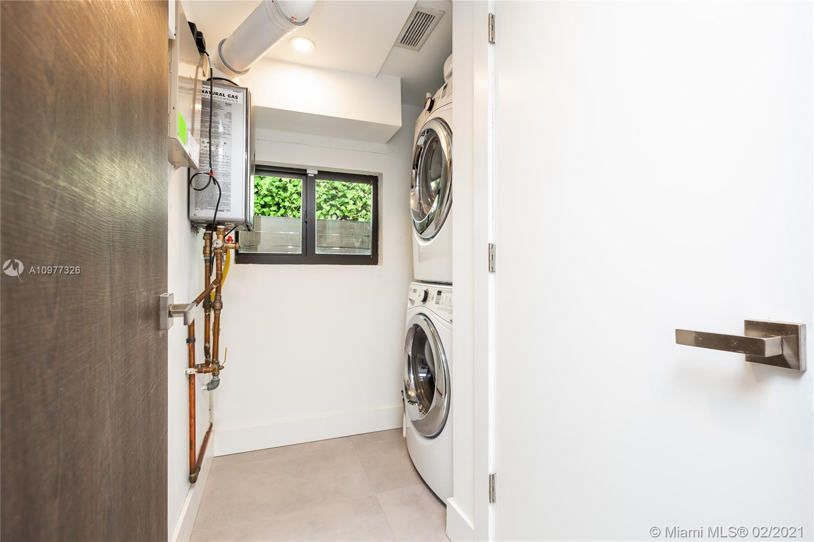 5185 Alton Road Miami Beach, FL 33140 - Photo 33 of 41 a utility room with a washer and dryer