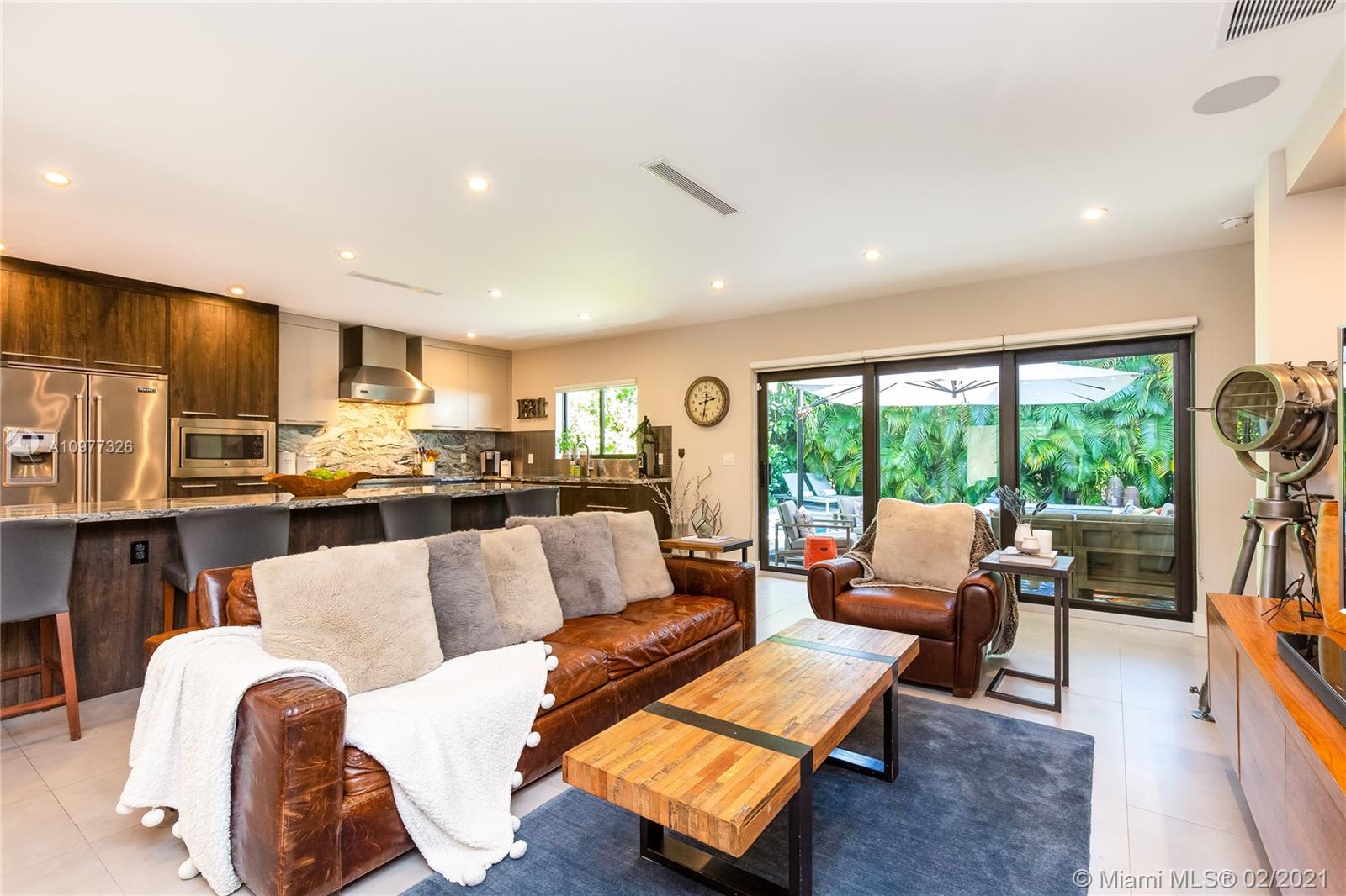 5185 Alton Road Miami Beach, FL 33140 - Photo 5 of 41 a living room with furniture and a large window