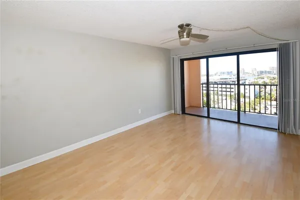 a view of an empty room with a window