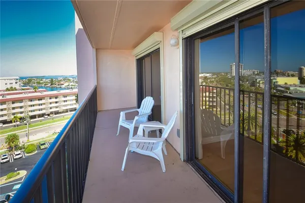 a balcony with chairs