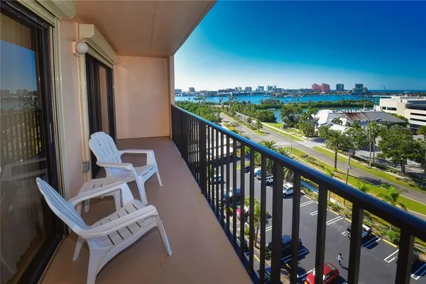 a view of balcony with furniture