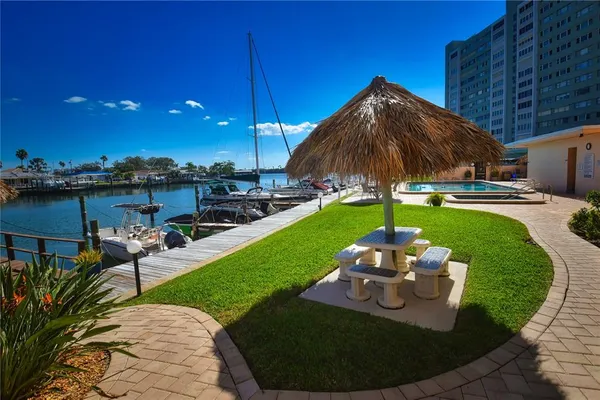a view of a backyard with sitting area