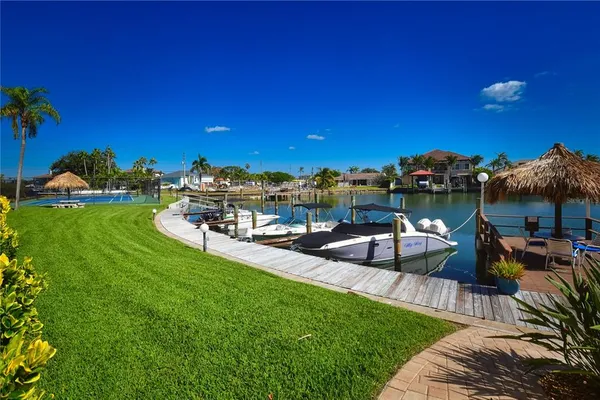 a view of a lake with couches and city view