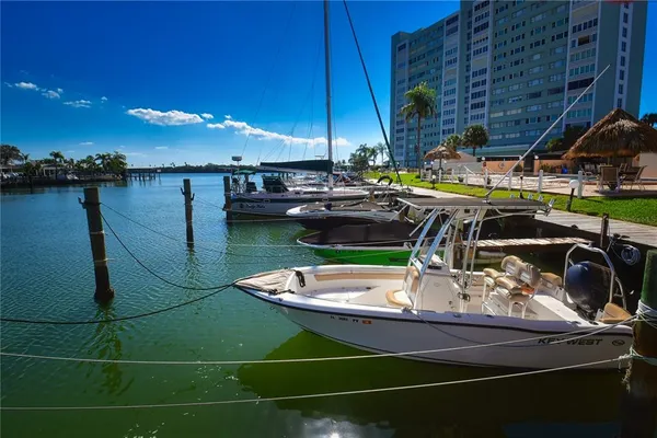 a view of a swimming pool with outdoor seating