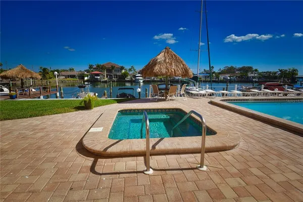 a view of a swimming pool and lounge chairs