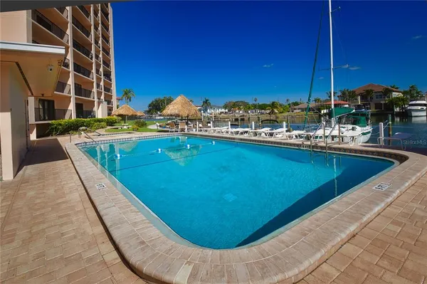 a view of a swimming pool with a lounge chair