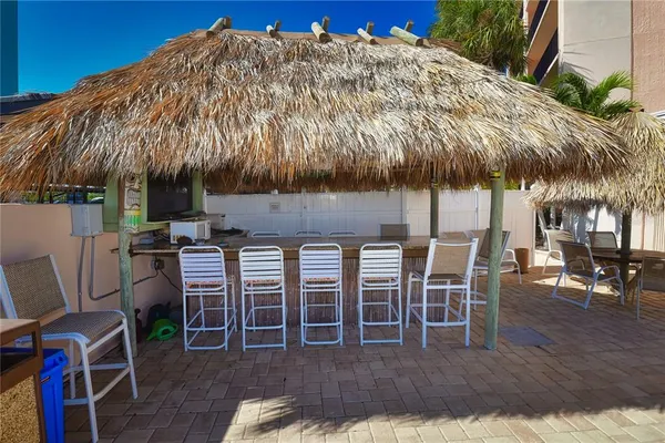 a view of a backyard with sitting area