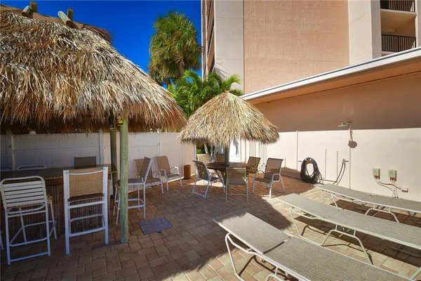 a view of a dinning table and chairs in patio