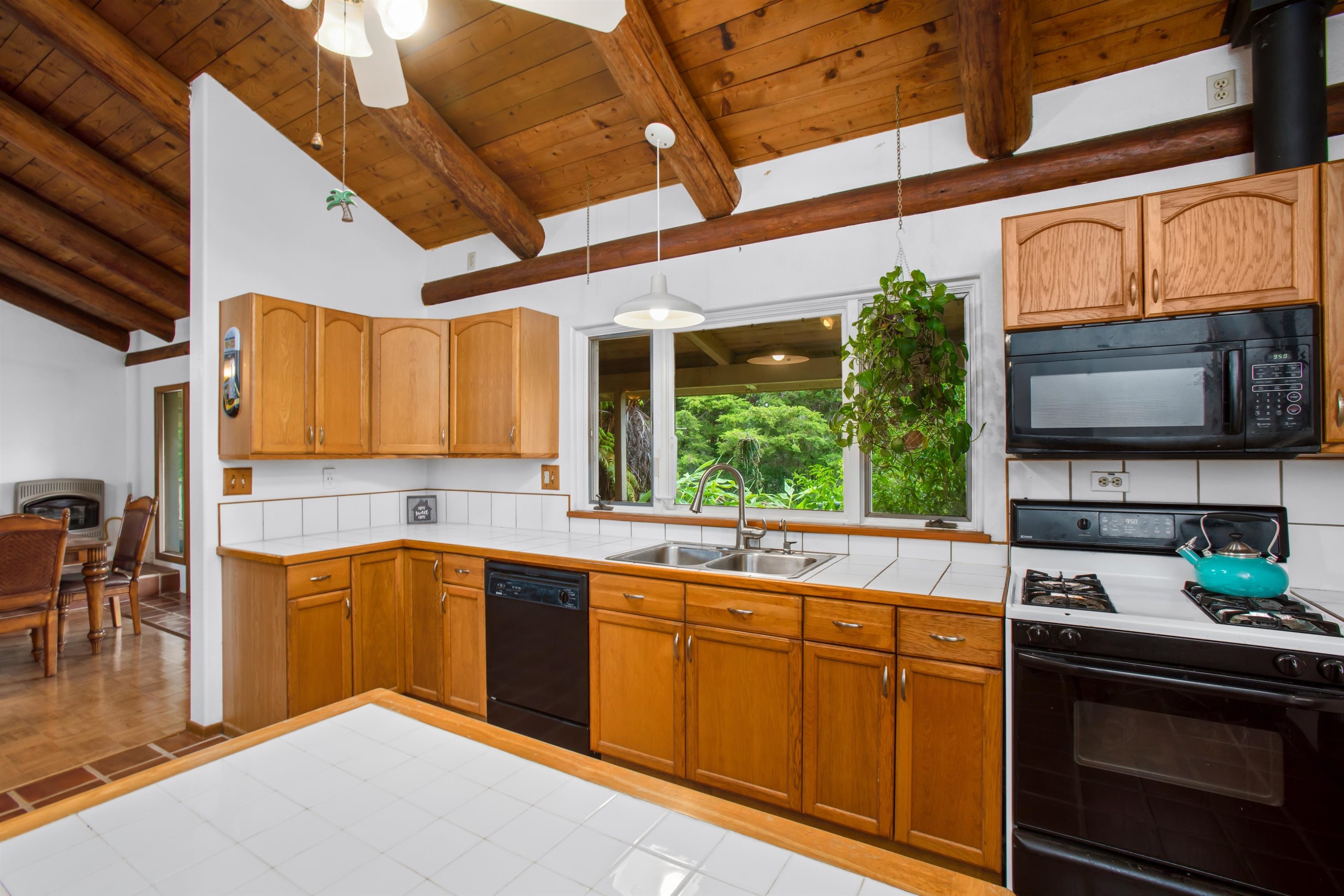 1160 Ehu Road Makawao, HI 96768 - Photo 12 of 18 a kitchen with stainless steel appliances granite countertop a sink and cabinets