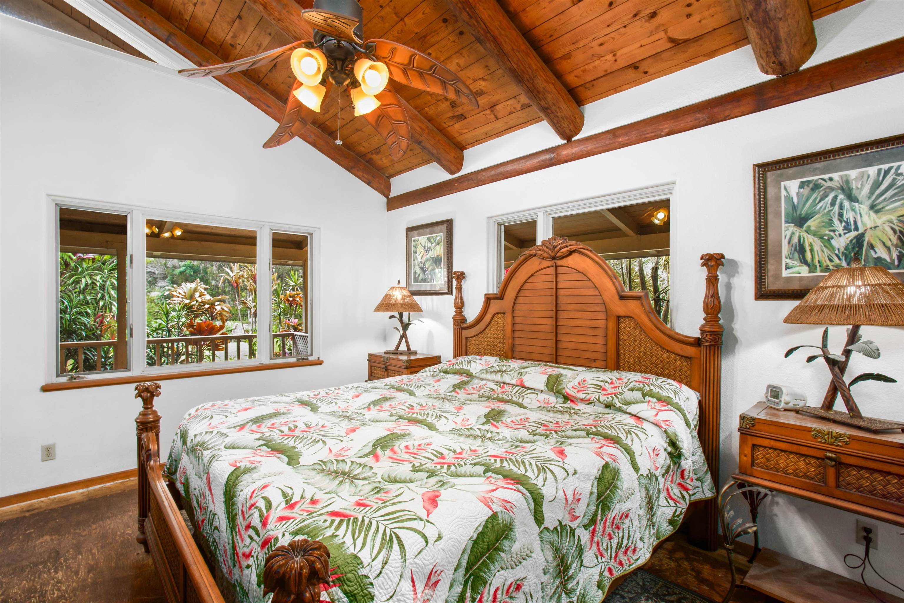 1160 Ehu Road Makawao, HI 96768 - Photo 5 of 18 a bedroom with a bed and a large window