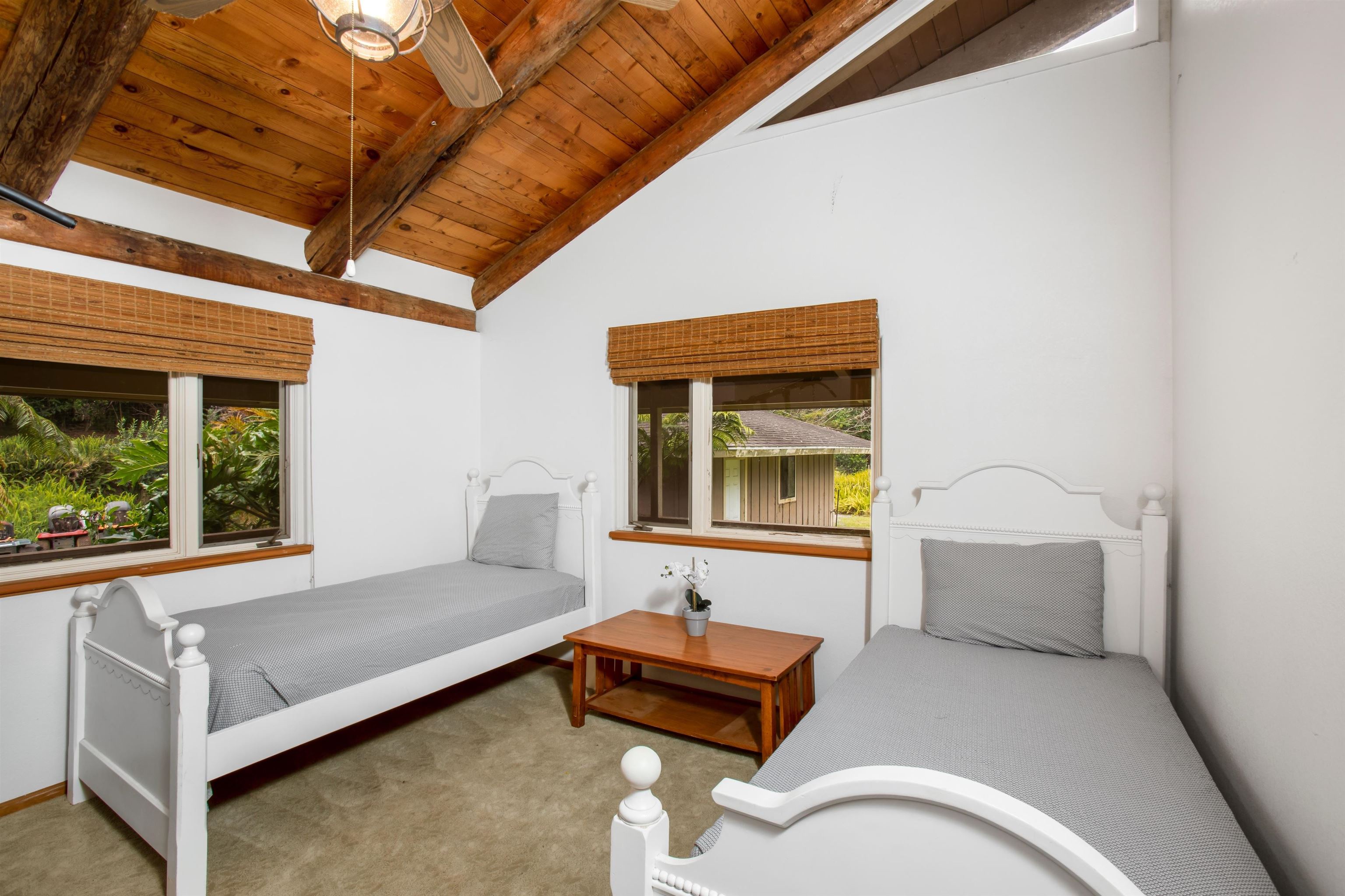 1160 Ehu Road Makawao, HI 96768 - Photo 7 of 18 a bedroom with furniture and a window