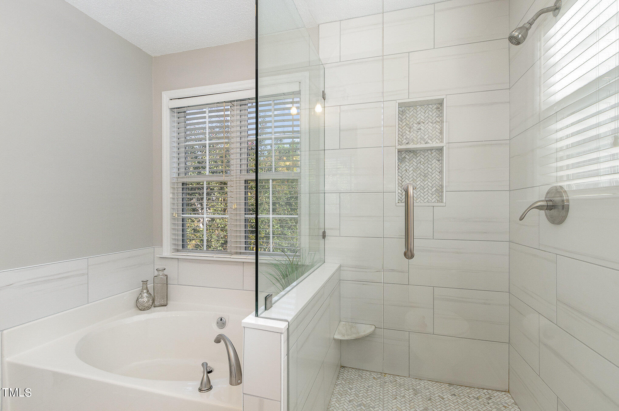 9221 Shallcross Way Raleigh, NC 27617 - Photo 18 of 28 a bathroom with a bathtub and window