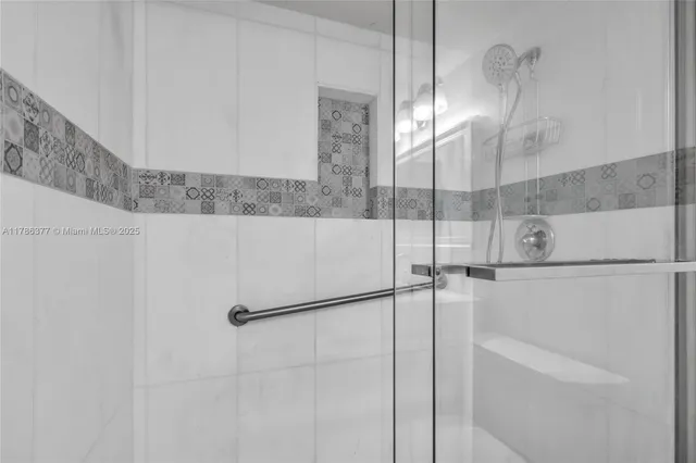 a bathroom with a shower and a mirror