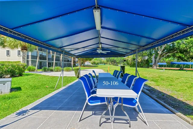 a view of yard with seating area and furniture